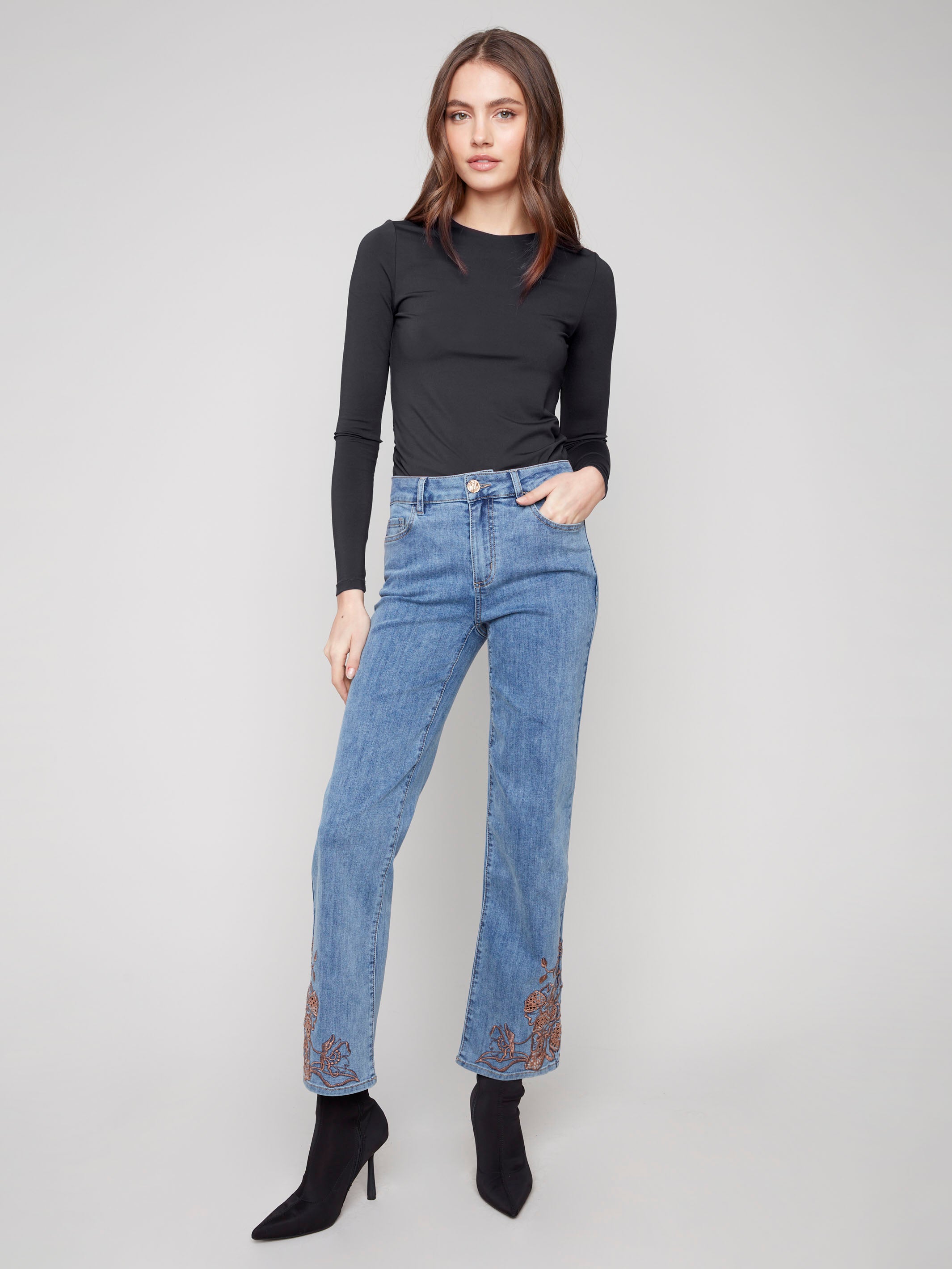 Medium blue jeans with a straight leg cut, showcasing a regular rise and elegant style, perfect for any occasion by Charlie B.