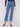 Blue denim straight-leg jeans with studs on pockets, offering stretch for comfort and style by Charlie B.