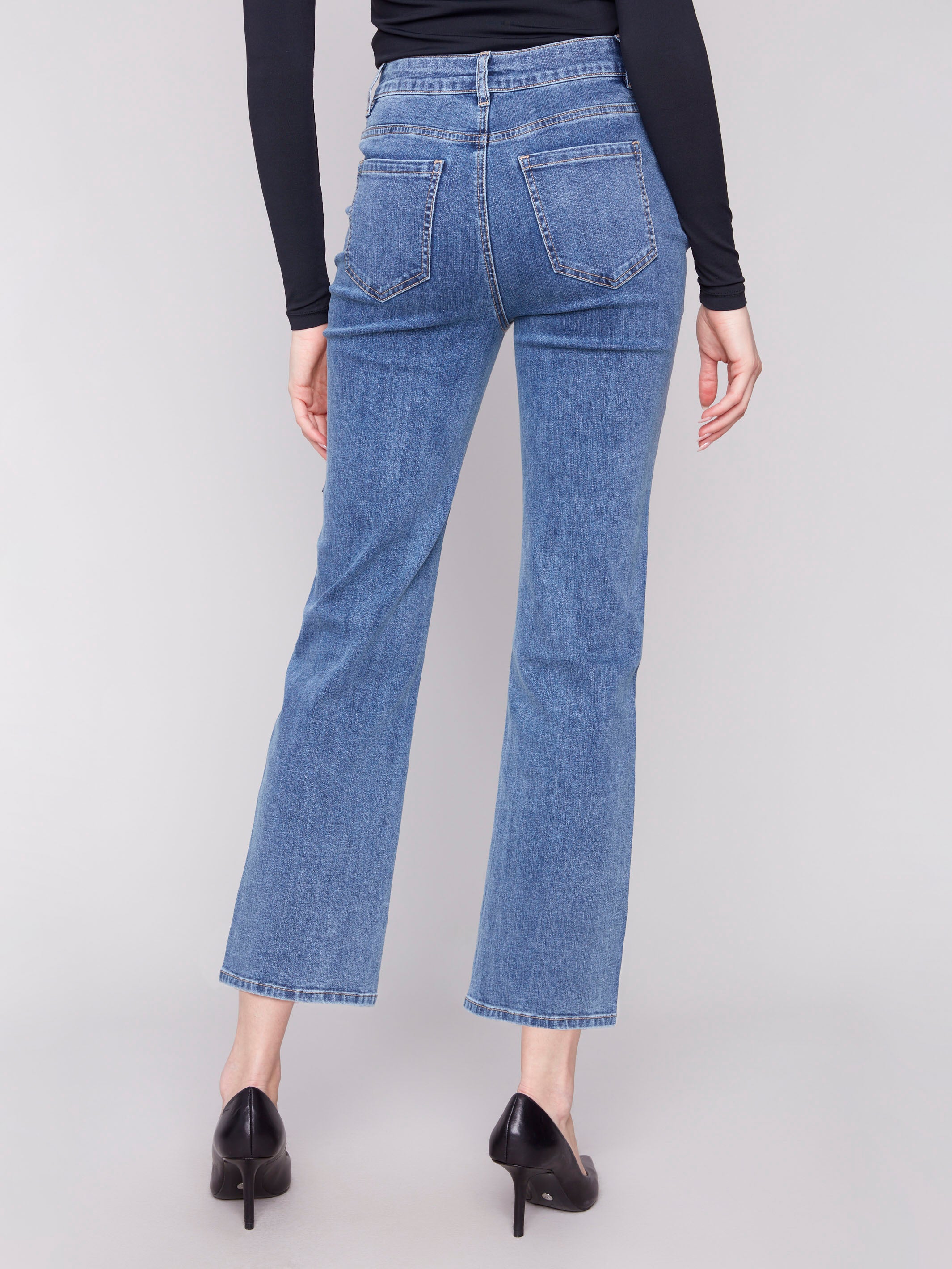 Straight-leg medium blue jeans crafted from stretch denim, complete with a button front closure by Charlie B.