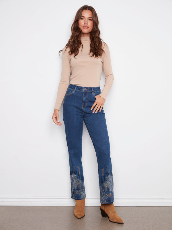 Indigo jeans with a five-pocket design and metallic floral embroidery, offering a stylish straight fit by Charlie B.