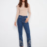 Indigo jeans with a five-pocket design and metallic floral embroidery, offering a stylish straight fit by Charlie B.