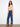 Regular rise indigo jeans with stunning metallic floral patterns at the hem, crafted for comfort and style by Charlie B.