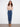 Five-pocket indigo jeans showcasing beautiful metallic floral embroidery on the hem, perfect for any occasion by Charlie B.