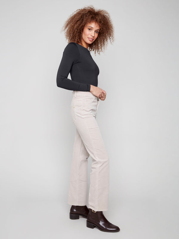 Experience the elegance of these oat corduroy pants with their five-pocket design and versatile appeal by Charlie B.