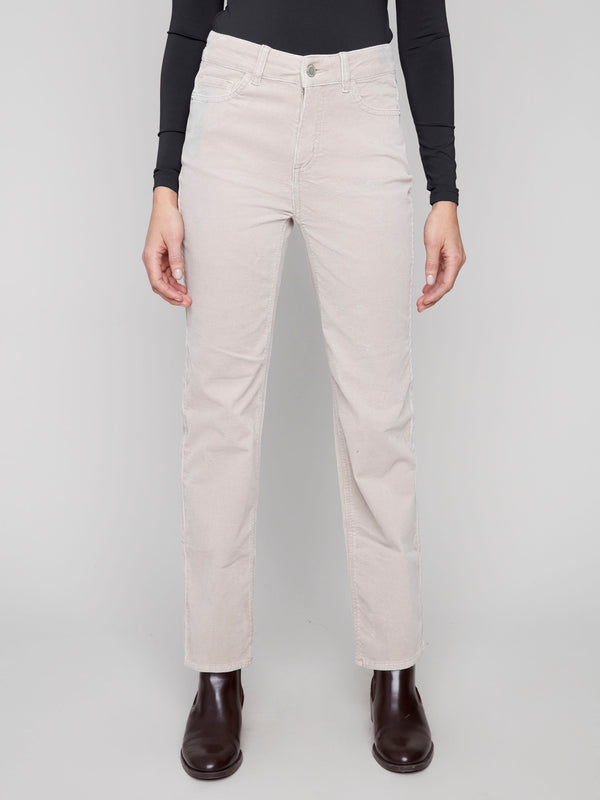 These oat corduroy pants offer a regular rise with stretch material, ensuring comfort and style by Charlie B.