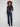 Deep blue jeans featuring a flattering flare leg and rivet accents, crafted from stretch denim for comfort by Charlie B.