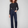 Deep blue jeans featuring a flattering flare leg and rivet accents, crafted from stretch denim for comfort by Charlie B.