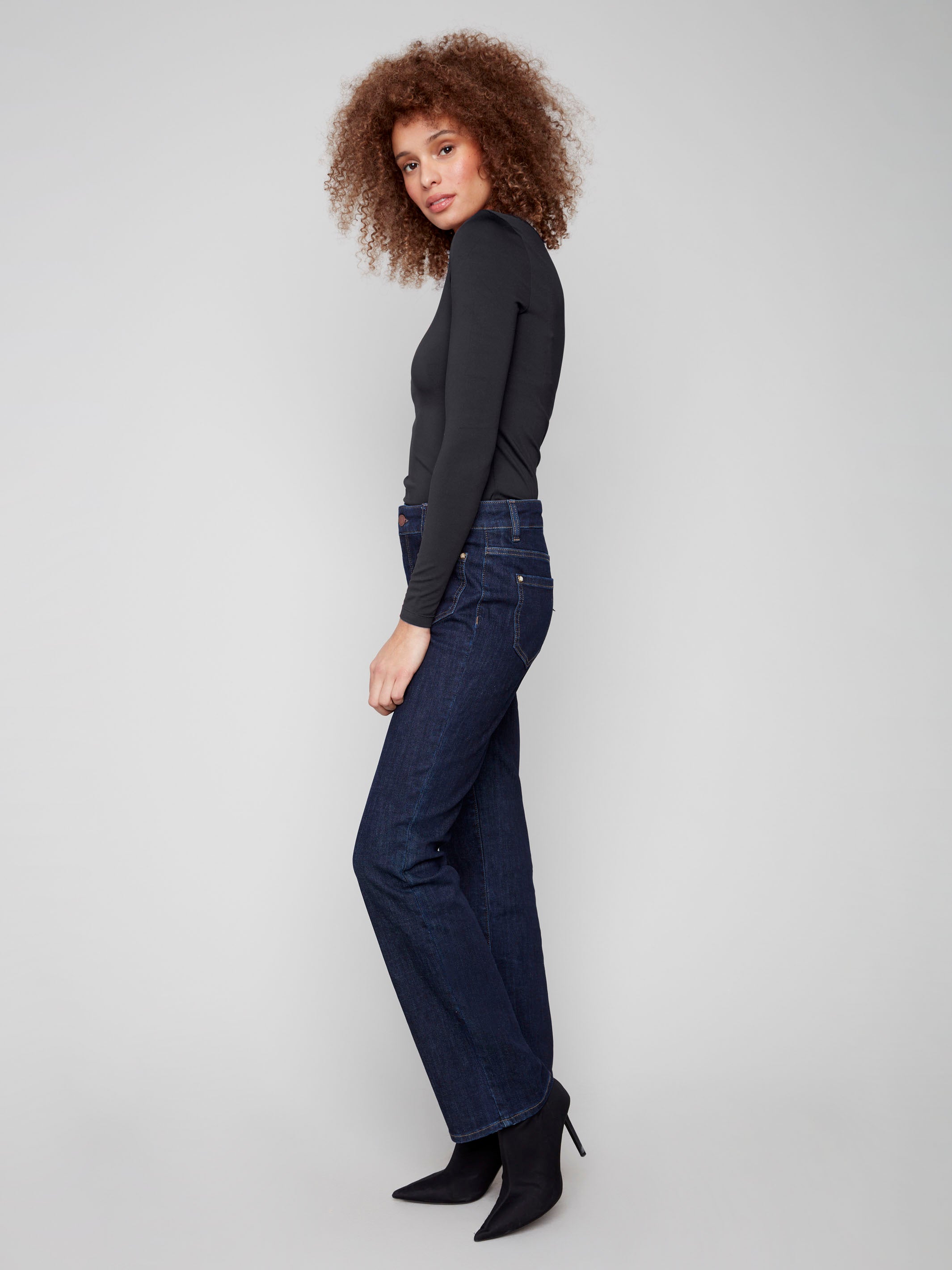 Classic deep blue jeans with regular rise and special rivets, designed for both style and comfort by Charlie B.