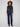 Elegant deep blue jeans showcasing back pockets and a modern flare leg design in stretch denim by Charlie B.