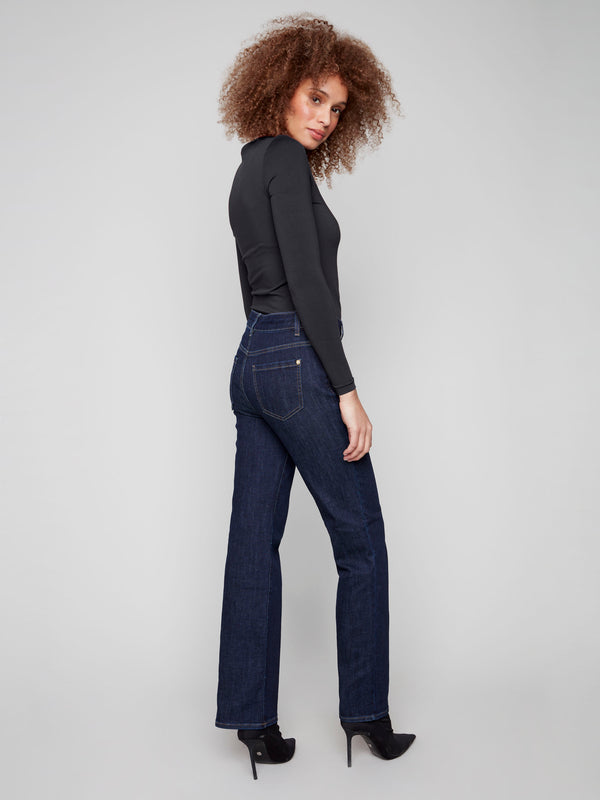 Chic deep blue jeans with front patch pockets and an elongated silhouette, perfect for versatile styling by Charlie B.