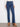 Stretch denim indigo jeans with side pockets and button accents, elegantly styled for a chic look by Charlie B.