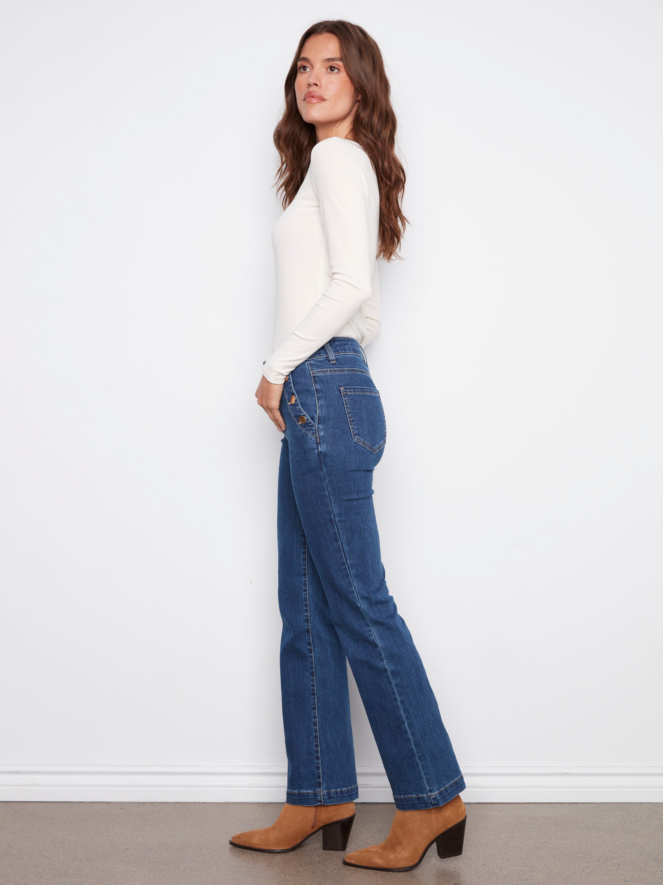 Long length indigo jeans with back pockets and flared legs, adding elegance to any outfit by Charlie B.