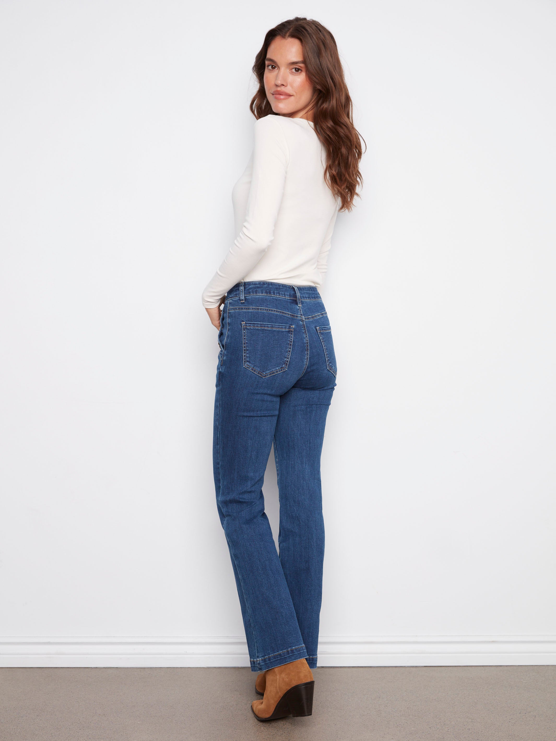 Indigo flare leg jeans showcasing stylish button details on the pockets for an elevated look by Charlie B.