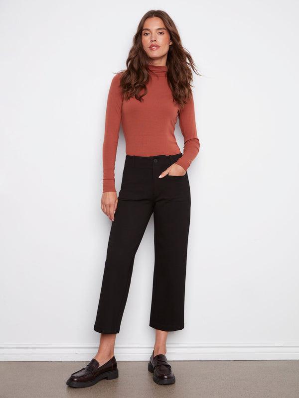 Black ponte pants with a cropped length, offering modern style and comfort by Charlie B.