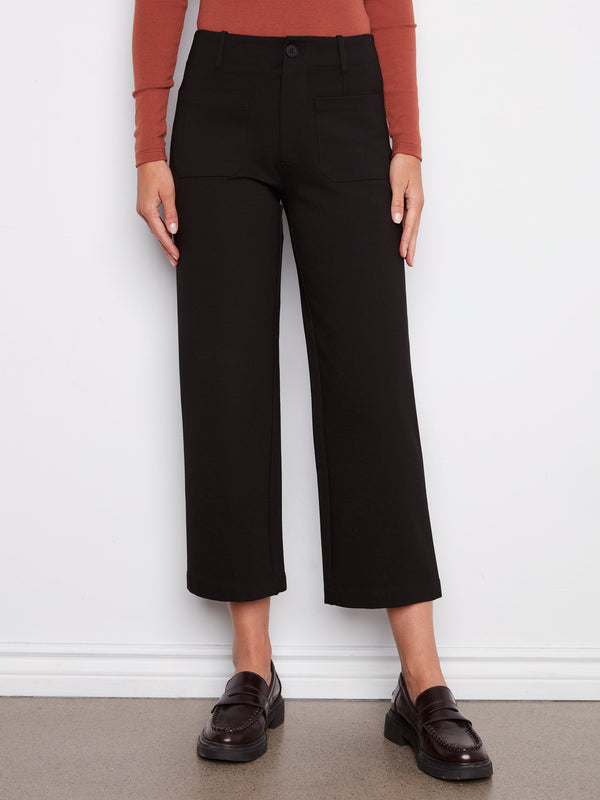 Stylish black pants featuring two front patch pockets for added functionality by Charlie B.