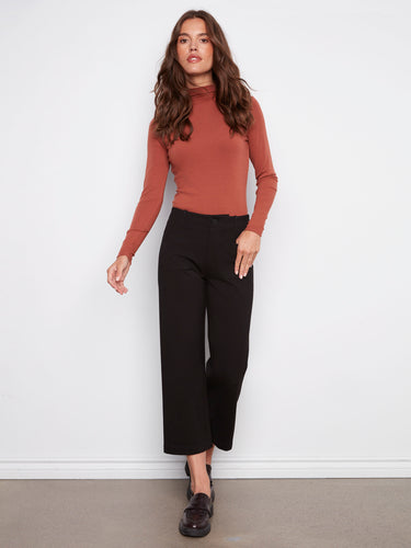 Crafted from ponte stretch fabric, these black pants ensure a comfortable fit by Charlie B.