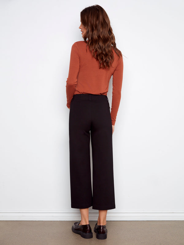 Featuring two back patch pockets, these black pants combine style with practicality by Charlie B.