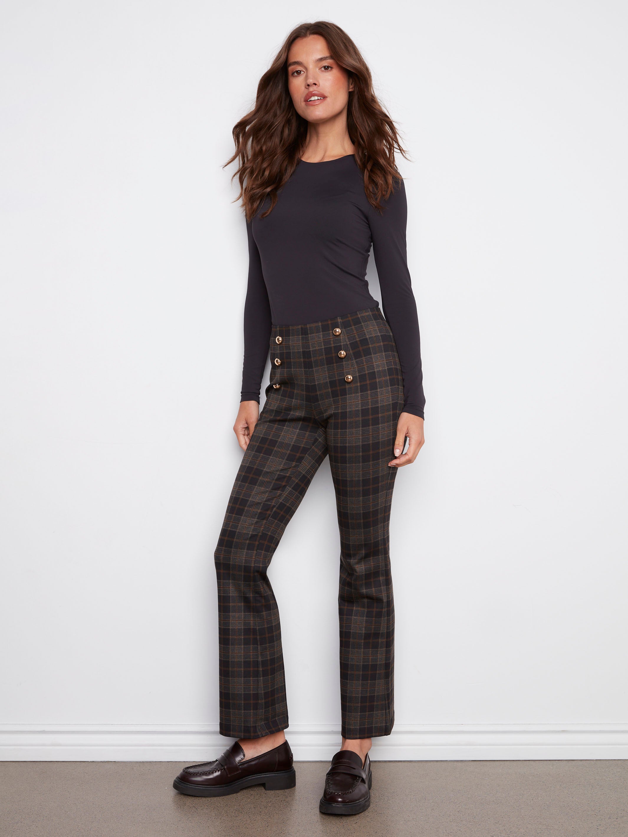 Crafted from stretch fabric, these plaid flare pants ensure comfort and movement throughout your day by Charlie B.