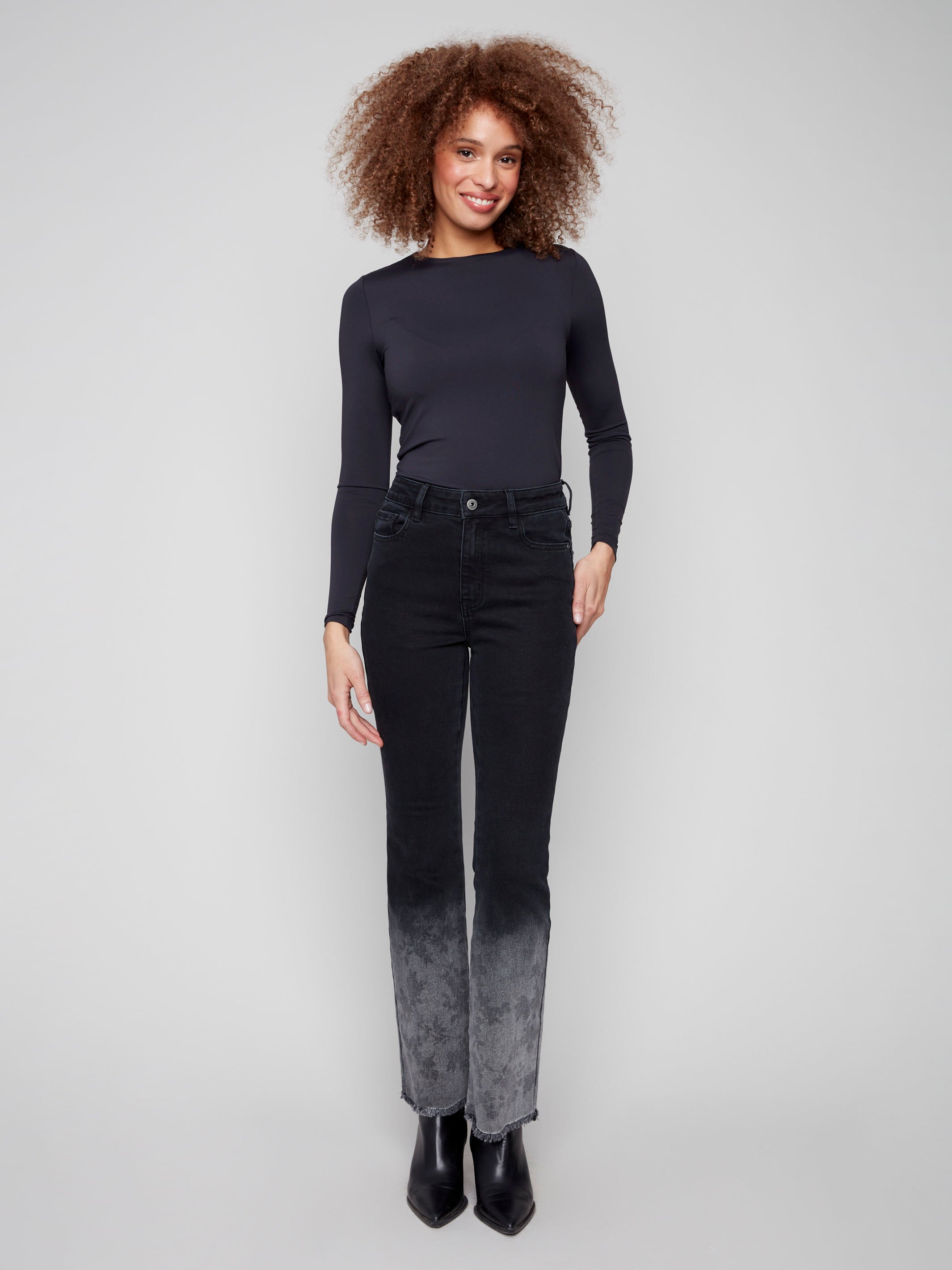 Charcoal jeans with a washed frayed hem and flare leg, crafted in stretch denim for comfort by Charlie B.