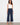 Navy cropped dressy pants with a belted waist and side zipper closure, featuring wide legs by Charlie B.
