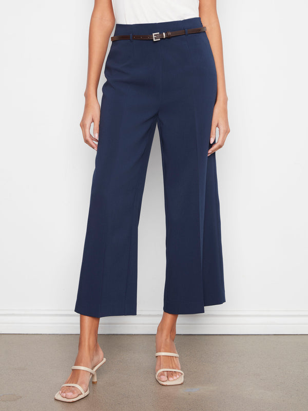 Navy dressy pants in a cropped length with stretch fabric and wide legs, complete with a belted waist by Charlie B.