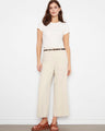 Beige pants with a wide leg design, perfect for a chic look. The regular rise adds to the comfort and style. By Charlie B.