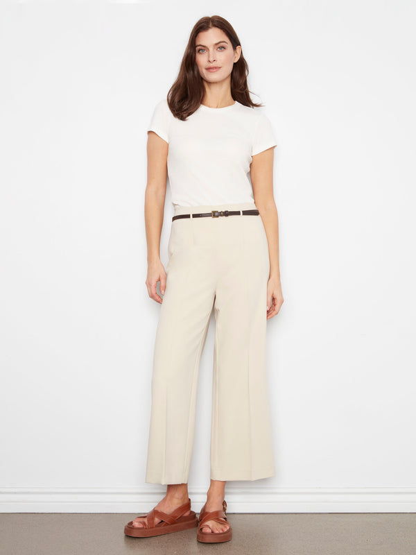 Beige pants with a wide leg design, perfect for a chic look. The regular rise adds to the comfort and style. By Charlie B.