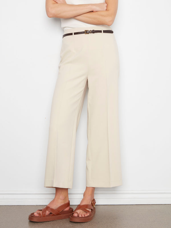 These cropped length beige pants are ideal for a modern, casual outfit. The stretch fabric ensures ease of movement. By Charlie B.