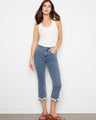 Medium blue jeans with a slim fit and flared leg, featuring floral embroidery at the hem and a classic design by Charlie B.