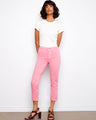 Pink cropped pants with a slim fit silhouette, featuring cuffed hems for added style. By Charlie B.