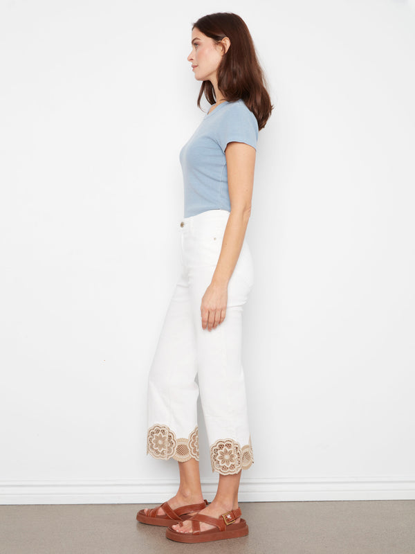 Experience the regular rise fit of these stylish white pants, enhanced with beautiful lace detailing at the hem by Charlie B.
