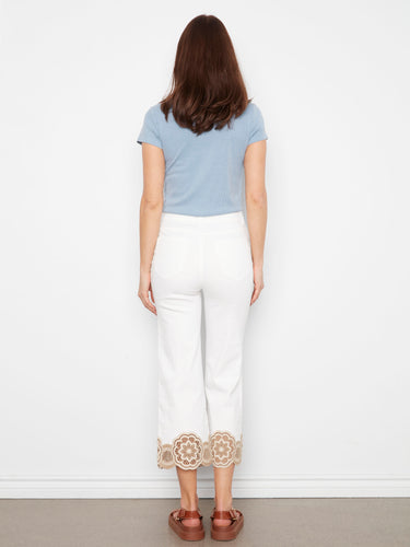 Elegant white pants crafted from stretch twill fabric, showcasing a charming lace hem for a touch of sophistication by Charlie B.