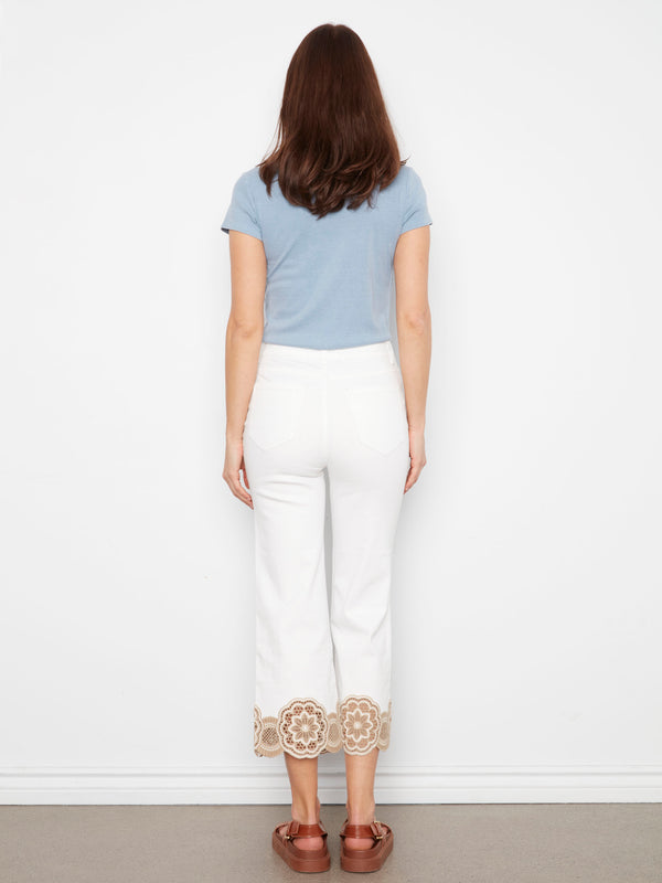 Elegant white pants crafted from stretch twill fabric, showcasing a charming lace hem for a touch of sophistication by Charlie B.