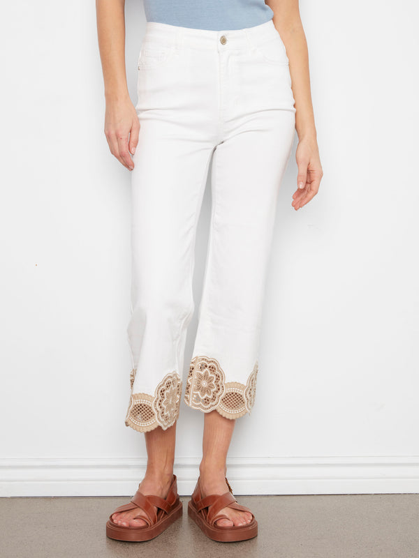 White pants featuring an exquisite lace hem detail and flared leg design, perfect for adding flair to any outfit by Charlie B.