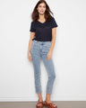 Light blue jeans with a slim fit, featuring a chic blanket stitch hem for added style by Charlie B.