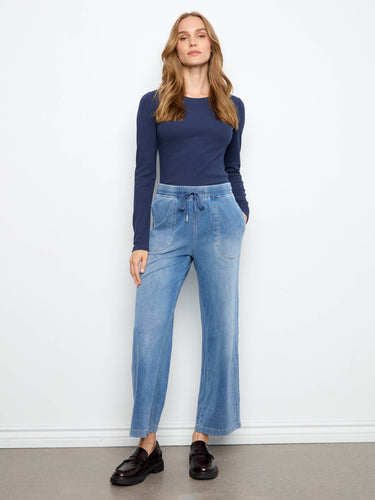 Medium blue knit denim joggers with a regular rise and elastic waistband featuring drawstring detail by Charlie B.