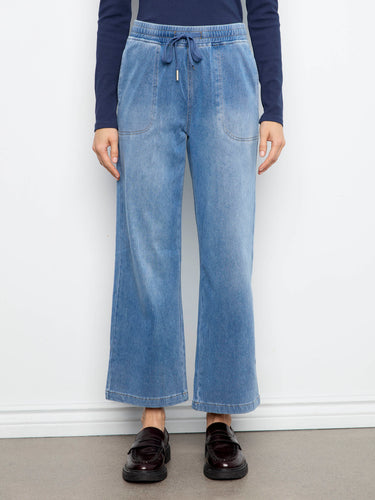 These soft knit denim joggers showcase wide legs and practical slash pockets for style and convenience by Charlie B.