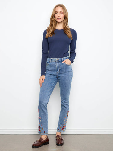 Medium blue jeans with a slim leg and vibrant floral embroidery at the hem, crafted in stretch denim by Charlie B.