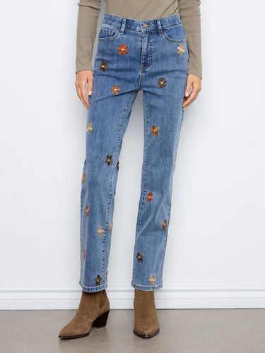 These jeans showcase beautiful floral embroidery that adds a touch of elegance to your casual wear. By Charlie B.