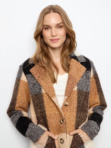 The longline silhouette of this coat provides warmth and style for cooler days. By Charlie B.