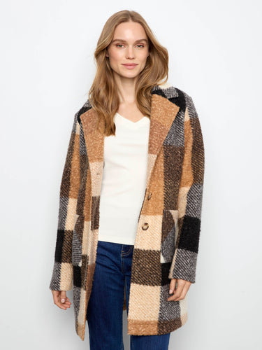 Plaid design combined with button closure creates timeless appeal in this piece by Charlie B.
