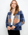 This jacket features a stylish snap-button closure, adding a modern touch to its classic design by Charlie B.