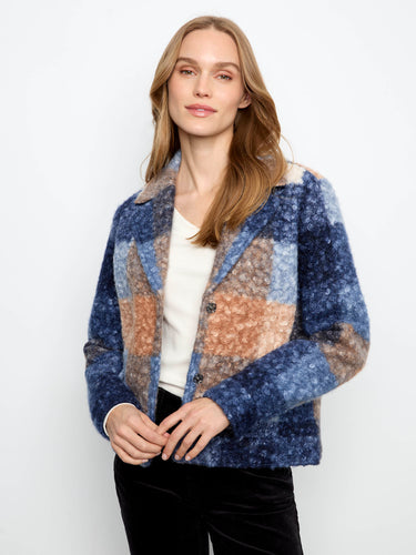 This jacket features a stylish snap-button closure, adding a modern touch to its classic design by Charlie B.