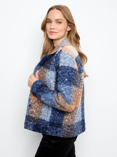 The snap-button closure adds convenience and elegance to this beautifully crafted jacket by Charlie B.