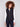 Black vest with quilted floral design, highlighted by convenient welt pockets and stylish high collar by Charlie B.