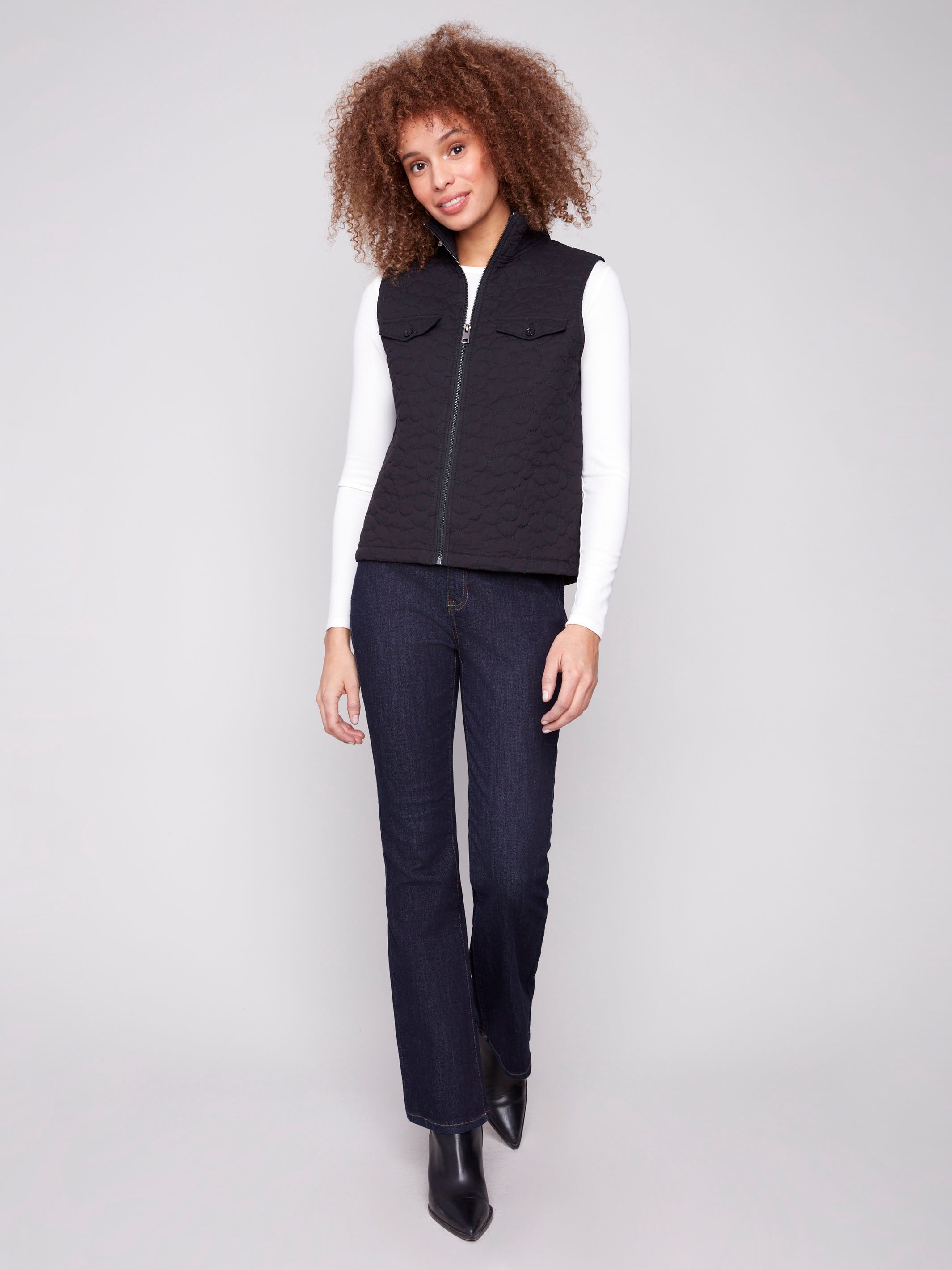 Chic black vest featuring a zip front closure and elegant quilted pattern for a trendy look by Charlie B.