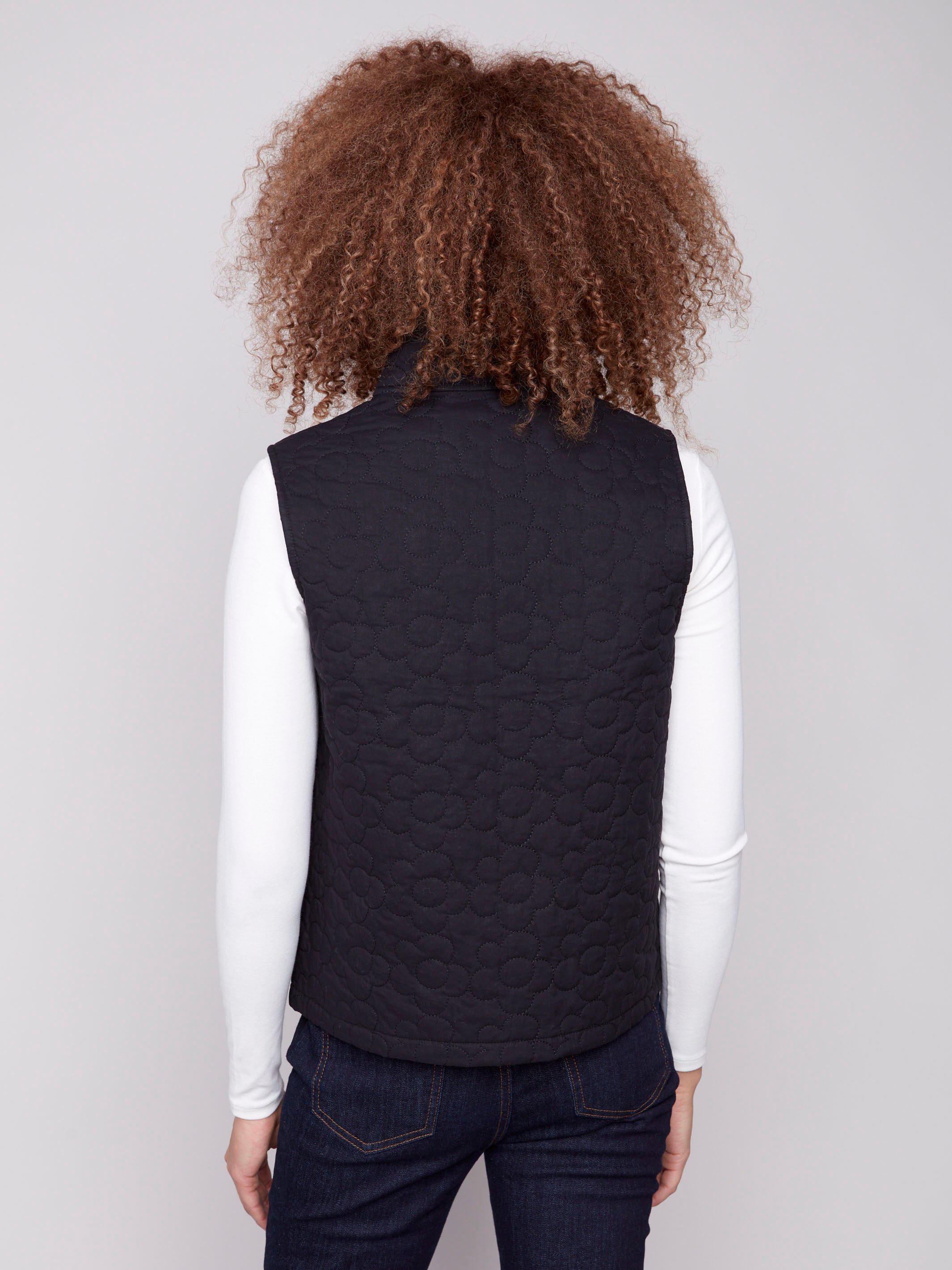 Stylish black vest adorned with a detailed quilted floral pattern, perfect for any occasion by Charlie B.