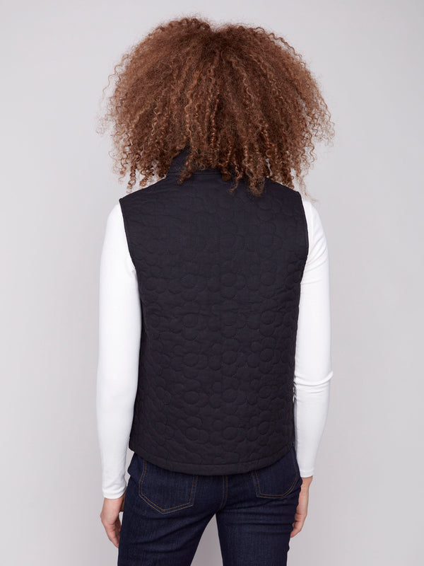 Stylish black vest adorned with a detailed quilted floral pattern, perfect for any occasion by Charlie B.