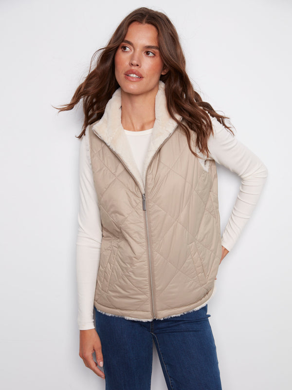 Quilted reversible vest with zipper front closure, ideal for versatile styling by Charlie B.