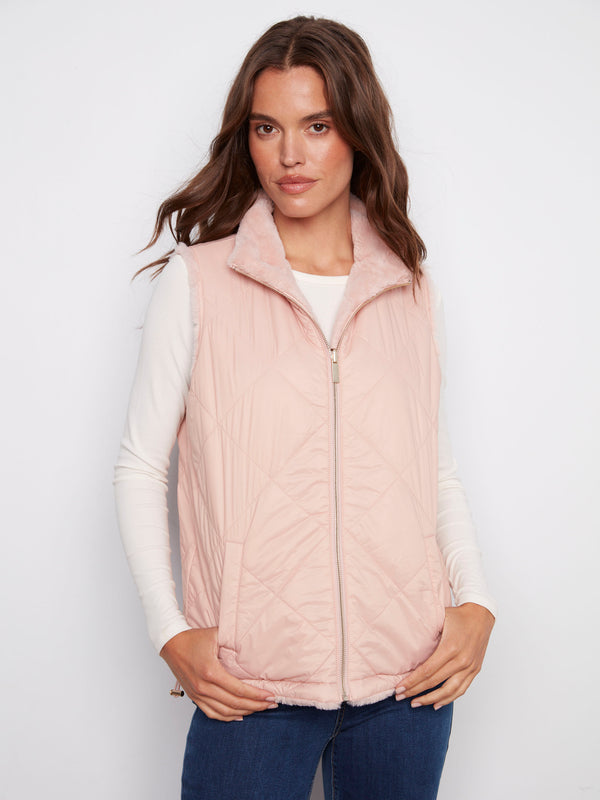 Reversible quilted vest in ballet pink, showcasing a sleek zipper front closure by Charlie B.